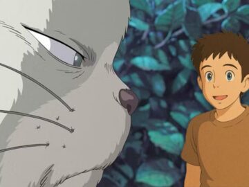 An image of Niya the cat looking at a Studio Ghibli-style portrait of OpenAI CEO Sam Altman